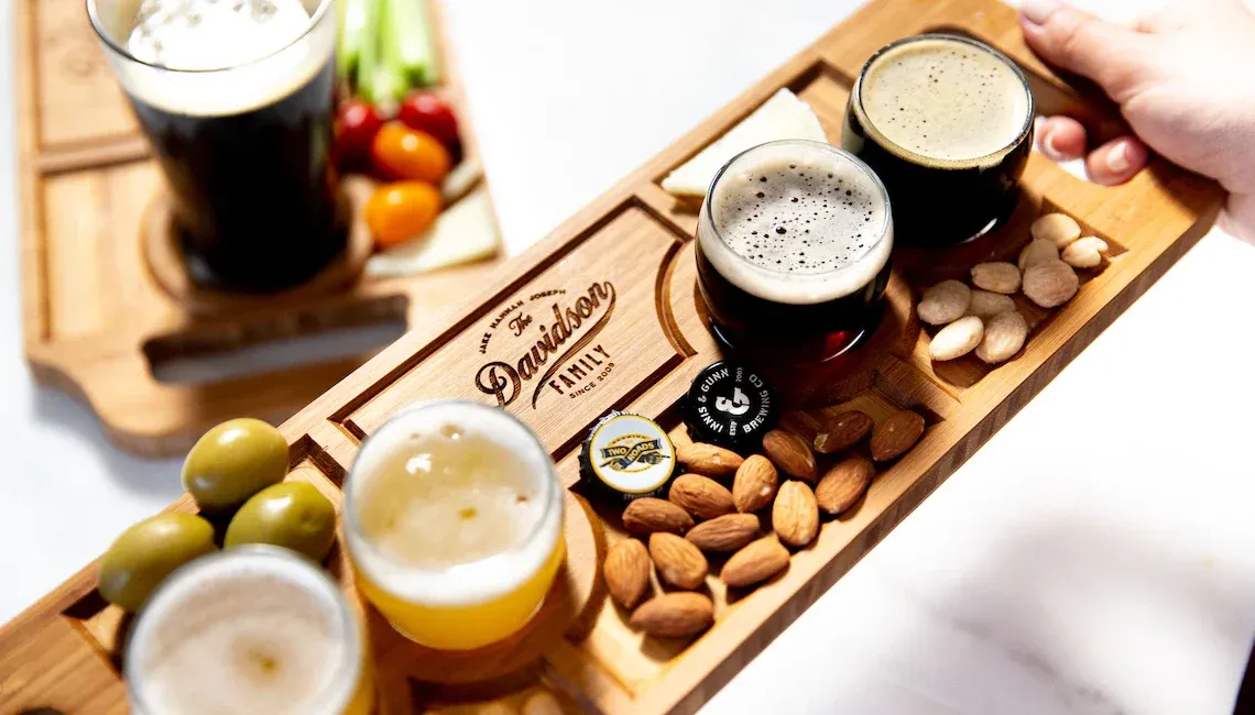 A tasting board with cocktails and snacks